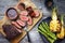 Barbecue dry aged wagyu tri tip steak with grilled pineapples and green asparagus on a wooden cutting board