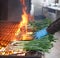 Barbecue fire with CalÃ§ots, a young Catalan onion, and it is called "CalÃ§otada".  It's a barbecue with fire