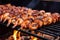 barbecue grill filled with skewered shrimp