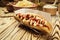 Barbecue Grilled Hot Dog with sauce,Hot Dog With Yellow Mustard,Onion,Pickles and French Fries,Tasty hot-dogs with vegetables on