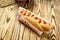 Barbecue Grilled Hot Dog with sauce,Hot Dog With Yellow Mustard,Onion,Pickles and French Fries,Tasty hot-dogs with vegetables on