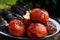 Barbecue grilled vegetables and meat, close-up. Baked tomatoes, aubergine