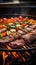 Barbecue grilling outdoors, closeup of delicious meat and vegetables