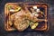 Barbecue Lamb Shoulder with Vegetables and Feta offered on wooden cutting board