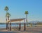 Barbecue and Picnic Table under a shade canopy and Palm Trees in Rotary Community Park, Lake Havasu, Mohave County, Arizona USA