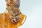 Barbecue pork neck stabbing in wooden stick dressing spicy sauce on white background