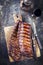 Barbecue Pork Spare Ribs offered on an old rustic cutting board
