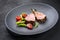 Barbecue rack of lamb neck with paprika and tomato on a modern design plate