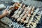 Barbecue on skewers of chicken legs and pork on coals