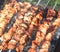 Barbecue skewers with juicy appetizing delicious meat closeup