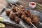 Barbecue skewers with juicy meat on plate