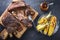 Barbecue sliced chuck beef ribs with hot rub with pineapple and corn view sliced on a wooden cutting board