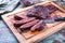 Barbecue wagyu bavette beef steak with red wine salt on a rustic wooden board