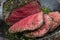 Barbecue wagyu point steak sliced on a rustic wrought-iron pan