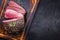 Barbecue wagyu sirloin steak sliced on a wooden cutting board