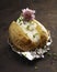 Barbecued baked potato with sour cream