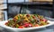 Barbecued kofta - bbq with vegetables on a plate. Selective focus