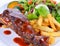 Barbecued pork ribs with French Fries