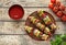 Barbecued turkey or chicken meat shish kebab skewers with ketchup