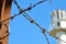 Barbed wire against the backdrop of the prison watchtower