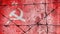 Barbed wire on the background of the flag of the USSR