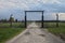 Barbed wire and fance around a concentration camp. Side entrance of the concentration camp.