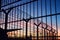 Barbed wire fence around a French immigration border with a beautiful colorful sky in the background located in Dieppe France