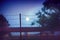 Barbed wire fence at the countryside ranch under the moon light, summer night