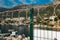 Barbed Wire on metal chainlink fence with a boatyard and marina