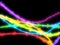 Barbed wire neon glow rainbow colors on black abstraction