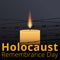 Barbed wire and one memorial candle, International Holocaust Remembrance Day poster, January 27