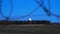 Barbed wire over abstract full moon sky background. Border with barbed wire of prison during night time with moon