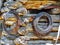 Barbed Wire Rolls Hanging on Log Cabin Wall Closeup