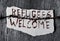 Barbed wire and text refugees welcome