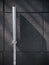 A barbell on an exercise mat with dramatic shadows