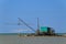 Barbell fishing shed or fishing hut at the river mouth