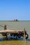 Barbell fishing shed or fishing hut at the river mouth