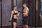 Barbell training man and woman in a gym