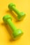 Barbells in small size made of plastic. Healthy lifestyle concept