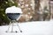 Barbeque grill covered with snow