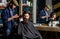 Barber and hipster client with beard checking haircut in mirror, dark background. Man with beard explain hairstyle he