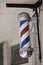 Barber pole on wall