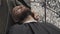 Barber shaving beard with electric razor in male salon. Shaving bearded man