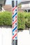 Barber shop glass sign pole red and blue.