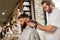 Barber Shop Men Hair Cut. Barber Doing Men Fashion Hairstyle