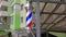 Barber shop sign, store shave striped vintage light symbol. American barber pole sign with a helical stripe. Red, white, and blue