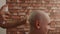 Barber spraying head of bald man after shaving in male salon. Hairdresser applying moisturizing spray on head skin after