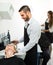 Barber washing customer\'s hair