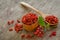 Barberries and goji berries on wooden background