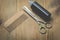 Barbershop concept. Hairbrushes, sprayer and a scissors on a wooden board, top view and copy space